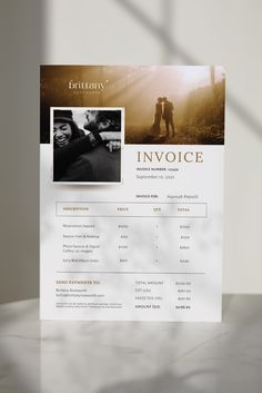 an invoice is displayed on top of a white table with sunlight coming through the window