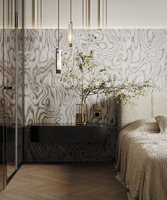 a bed sitting next to a wall covered in white and black art deco style decor