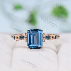 an engagement ring with a blue topazte stone