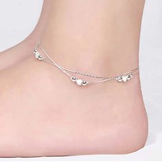 Silver 2 Tier Layered Ankle Bracelet Snake Chain With Hearts & Round Beads. See Photos For Details. Colors May Vary Due To Screen Differences & Lighting. Check Out My Closet! More Like This & Hundreds Of New & Preloved Items! Bundle & Save With Combined Shipping! All Items Must Be Bundled Together. Once You Agree To An Offer You Cannot Add More Items. Please Bundle & Send Me A Reasonable Offer, I Will Either Accept Or Counter. Womens Women Ladies Ladys Girls Feminine Dainty Elegant Glamorous Sop Silver Ankle Bracelets, Trendy Adjustable Heart-shaped Anklets, Adjustable Heart Metal Anklets, Adjustable Heart-shaped Metal Anklet, Trendy Adjustable Heart Anklets, Double Heart Bracelet With Adjustable Chain, Adjustable Heart-shaped Dainty Anklets, Elegant Adjustable Anklets With Heart Charm, Heart-shaped Metal Anklets For Gift