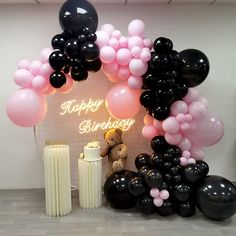 a birthday party with balloons and teddy bears