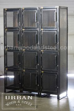 four metal lockers in a warehouse with the doors open