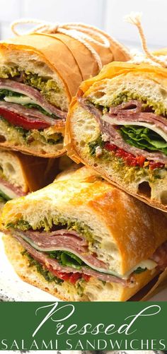 several sandwiches stacked on top of each other with the words, prepared salami and avocado sandwich