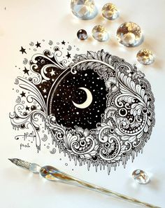 an artistic drawing with stars and moon in the sky, surrounded by crystal beads on a white surface