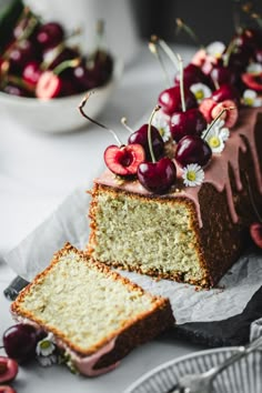 a piece of cake with cherries on top and some slices cut off from it