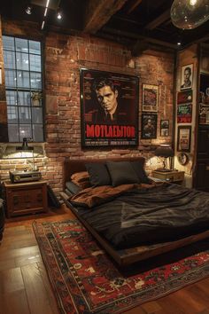 a bedroom with a brick wall and wooden flooring has a large poster on the wall