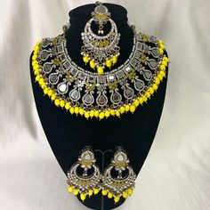 Tyaani inspired Yellow Silver Mirror Indian / Pakistani Jewellery Set - Necklace and Earrings & Tikka. Sabyasachi inspired Lightweight and comfortable. We have a large inventory - message us what shade you are looking for or send picture of your outfit to match. Fast shipping - Canada & USA "Life is better ... with a Touch of Elegance". Message for any questions. Yellow Chandbali Jewelry With Intricate Design, Festive Yellow Jewelry With Intricate Design, Temple Jewelry Sets With Mirror Work For Celebration, Temple Jewelry Set With Mirror Work For Celebrations, Handmade Yellow Bollywood Jewelry, Silver Jewelry Sets With Mirror Work For Celebration, Traditional Yellow Jewelry Sets For Festive Occasions, Temple Jewelry Style Bridal Necklace In Yellow, Traditional Yellow Jewelry For Festive Occasions