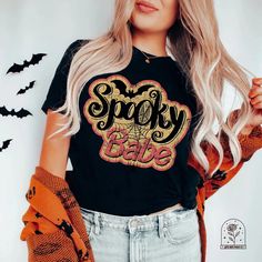 Spooky Babe Shirt, Halloween Sweatshirt, Halloween Shirts, Halloween Tshirts, Halloween Crewneck, Halloween Sweatshirts, Halloween T Shirts, Halloween Tshirt, Halloween Hoodies, Halloween T-Shirt, Halloween Hoodie, Fall Shirt, Fall Sweatshirt PLEASE NOTE: These t-shirts are unisex and fit true to size! If you prefer an oversized fit, be sure to size up! For a T-Shirt Dress Style fit, size up 2+ sizes. There is a size chart in the listing photos which has the measurements for you to be able to pi Halloween Hoodies, Spooky Babe, Babe Shirt, Halloween Crewneck, Halloween T Shirts, Halloween Tshirt, Halloween Doll, Halloween Hoodie, Sweatshirt Halloween