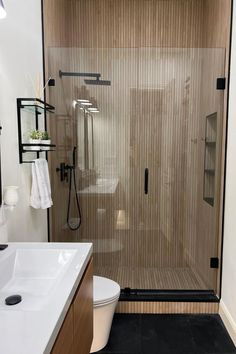 a bathroom with a walk in shower next to a sink