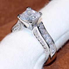 a close up of a ring on a napkin