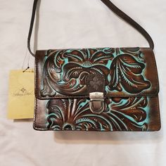 Patricia Nash Genuine Leather Tooled Turquoise Crossbody Locri. Turquoise Hand Tooled Rectangular Shoulder Bag, Hand-tooled Blue Crossbody Shoulder Bag, Blue Hand Tooled Rectangular Shoulder Bag, Hand Tooled Blue Crossbody Bag, Blue Rectangular Hand Tooled Shoulder Bag, Turquoise Hand Tooled Bag, Blue Leather Hand Tooled Shoulder Bag, Blue Hand Tooled Leather Shoulder Bag, Hand Tooled Blue Leather Shoulder Bag