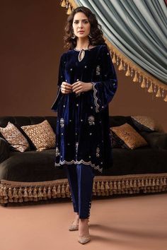 Navy blue velvet knee length kurti embellished with sequin, cudana and beads hand embroidery over the front and sleeves.It has matching silk straight pant with organza dupatta. ✨This super stylish elegant dress is best for wedding,festival and  formal event. ✨This dress can be customise in any other colour and in all size, please contact us regarding any changes if you want.We will make this dress as per your choice. 🌸If your body measurement does no matches with the size chart you can mention your personalised measurement while purchasing. You can give your measurement in Cm if you don't understand measurement un inches.  Height is your overall body height.  ✨we use high quality fabric and threads for embroidery. Our dresses take little longer time, we take care of every minute details w Velvet Salwar Kameez, Velvet Salwar, Velvet Pakistani Dress, Embroidered Velvet Dress, Blue Velvet Suit, Velvet Kurti, Velvet Suit Design, Velvet Dress Designs, Kurti Pant