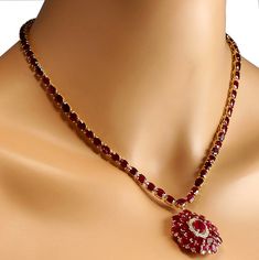 Stamped: 14K Yellow Gold Total Necklace Weight: 24.3 Grams Necklace Length: 17 Inches Gemstone Weight: Total Natural Center Ruby Weight is 1.66 Carat (Measures: 9.00x6.85 mm) Color: Red Gemstone Weight: Total Natural Side Ruby Weight is 51.02 Carat Color: Red Diamond Weight: Total Natural Diamond Weight is 1.00 Carat Quantity: 34 Color: F-G, Clarity: VS2-SI1 Face Measures: 32.70x29.40 mm Sku: [702600W] Luxury Ruby Necklace With Brilliant Cut, Formal Round Diamond Necklace With Gemstones, Oval Ruby Necklace With Brilliant Cut, Aaa Quality Red Jewelry For Formal Occasions, Ruby Necklace With Brilliant Cut, Brilliant Cut Ruby Necklace In Round Shape, Formal Ruby Diamond Necklace With Brilliant Cut, Classic Ruby Necklaces For Formal Occasions, Exquisite Round Ruby Necklaces