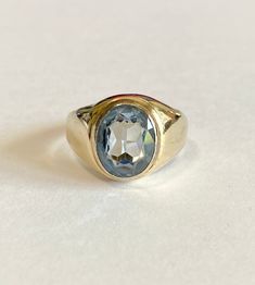 Handsome vintage 10k yellow gold men's created blue spinel signet ring, with an estimated total spinel weight of 5.05 cts. A classic and substantial gold ring, circa 1980s! This timeless piece of fine retro jewelry would make a lovely vintage gift for him. Chunky retro gold blue spinel ring! ERA - Circa 1980s / Mid-Century METAL / MATERIAL - 10k yellow, lab created oval faceted Blue Spinel (estimated 5.05 ct), MARKINGS / HISTORY - 10k PSCO ( Plainville Stock Co.) CONDITION - Good vintage conditi Gold Skies, Blue Spinel, Spinel Ring, Yellow Lab, Retro Jewelry, Unisex Jewelry, Metal Material, Ring Vintage, Signet Ring