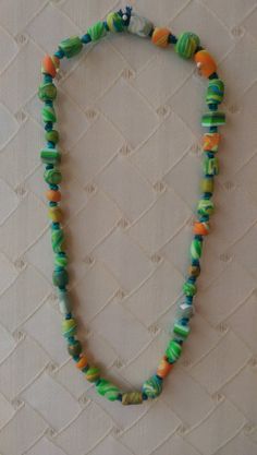 Colorful necklace is strung with unique, handmade clay beads. Every item is one-of-a-kind, inspired by nature, swirling colors, and love of life and music. Clay is oven-baked Hand-knotted I create each bead and jewelry item by hand-forming the beads, baking them, then combining them together into unique necklaces. Handmade Hippie Green Beaded Necklaces, Adjustable Multicolor Beaded Necklace In Polymer Clay, Adjustable Multicolor Polymer Clay Beaded Necklace, Handmade Green Artsy Necklace, Hippie Style Green Beaded Necklaces With Round Beads, Artsy Green Necklaces For Jewelry Making, Hippie Green Round Bead Necklaces, Green Hippie Beaded Necklaces, Artsy Adjustable Green Necklaces