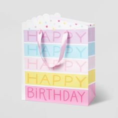 a birthday gift bag with the words happy birthday on it's front and bottom