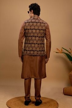 Brown kurta with pintucks detail. Paired with a brown printed bundi jacket with a curved hem and churidar. - Aza Fashions Brown Fitted Nehru Jacket For Winter, Fitted Brown Kurta For Festive Occasions, Fall Festive Nehru Jacket, Brown Fitted Sherwani For Eid, Festive Fitted Brown Kurta, Festive Fitted Brown Sherwani, Kurta Set Men, Kurta Set For Men, Nehru Jacket