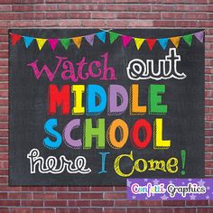 a chalkboard sign that says watch out middle school here i come