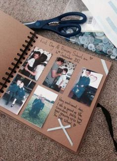 a scrapbook with pictures and scissors on the floor