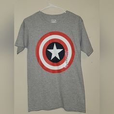 Captain America T-Shirt. Size Small. Never Worn Superhero Cotton T-shirt With Graphic Print, Superhero Fan Merchandise Cotton T-shirt, Superhero Cotton T-shirt With Letter Print, Captain America T Shirt, Captain America Tshirt, Tshirt Colors, Captain America, Marvel Comics, Kids Shirts