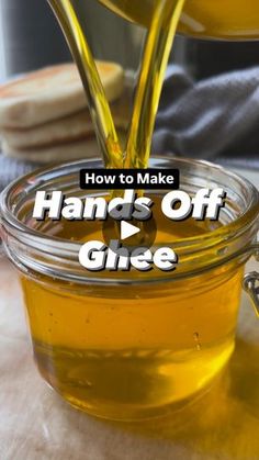 honey being poured into a jar with the words how to make hand's off glue