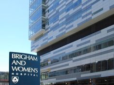 there is a sign that says birmingham and women's hospital in front of the building