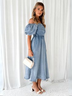 Indulge in luxurious fashion with our Patricia Off The Shoulder Denim Dress. Its off-the-shoulder design adds a touch of elegance, while the denim material exudes timeless sophistication. Perfect for any occasion, this dress will elevate your style and leave a lasting impression. Size Guide: Model is 5’6” tall, and has a 32.6” bust, 25.2” waist, & 34.7” hips. She is wearing a S / US 4 / AU 8. This dress is true to size. Material: 55% Denim Cotton. 45% Polyester. Feature: Strapless neckline. Off