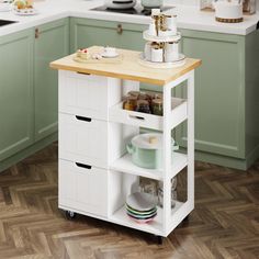 a kitchen island cart with drawers on wheels in the middle of a floored kitchen