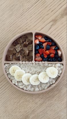 a plate with oatmeal, strawberries, and sliced bananas on it