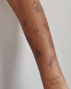 a person with tattoos on their arm