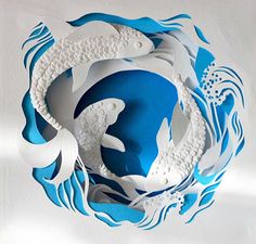 two white fish in a blue and white circle