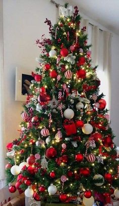 a christmas tree decorated with red and white ornaments