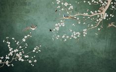 two birds are sitting on the branch of a tree with white flowers in front of a green background