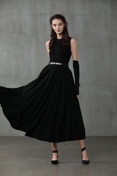 "Winter days do not mean that you need to resign to elegance. Boasting a soft wool-blend construction, this spiral skirt from Linennaive proves that you can be elegant and warm at the same time. Featuring a high waist, a rear zip fastening, a flared style, side pockets and a midi-length. 【Material】 -Wool 87%, Elastane 13% 【Length】 32-33 inches. 【Size】 *SIZE XS length: 32\"/82 cm waist: 26\"/ 66 cm *SIZE S length: 32\"/82 cm waist: 27\"/ 70 cm *SIZE M length: 32\"/82 cm waist: 29/ 75 cm *SIZE L l Elegant Evening Maxi Skirt For Fall, Black Lined Winter Dress, Black Winter Dress With Lined Skirt, Winter Evening Maxi Skirt With Lining, Black Winter Dresses With Lined Skirt, Winter Black Dresses With Lined Skirt, Evening Midi Maxi Skirt With Relaxed Fit, Pleated Maxi Skirt For Evening In Fall, Fall Evening Pleated Maxi Skirt