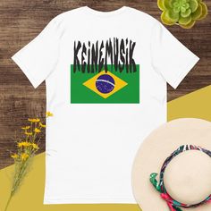 Immerse yourself in the energetic vibes of techno and house music with our exclusive Keinemusik Teeshirt. Crafted from premium quality cotton, this teeshirt is not just a clothing item but a statement piece for every music lover. The breathable fabric ensures comfort all day long, whether you're at a music festival or simply relaxing at home in Brazil. Available in various sizes, this shirt maintains its shape and color even after multiple washes, making it a reliable addition to your wardrobe. Cotton Shirt With Screen Print For Music Festivals, Cotton Screen Print Shirt For Music Festivals, Cotton Short Sleeve Shirt For Music Festivals, Cotton Shirt With Screen Print For Festival, Cotton Screen Print Shirt For Festivals, Relaxed Cotton Shirt For Music Festivals, Cotton Shirt For Festival Streetwear, Summer Cotton Shirt With Band Logo, Fitted Summer T-shirt With Band Logo