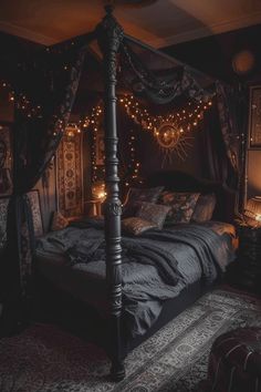 a bed with lights hanging from it's headboard in a dark colored room