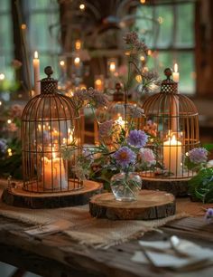 candles and flowers in cages on a table