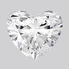 a heart - shaped diamond on a gray background, with the center cut in half