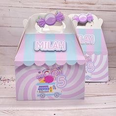 two pink and blue candy boxes with the word'miah'written on them