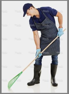 a man in an apron and rubber boots cleaning the floor with a broom, isolated on white background