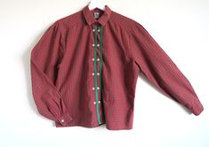 "Vintage checked cotton shirt by traditional Austrian brand Gössl. Small pointed collar and two rows of buttons, each of the buttoning edges trimmed with green patterned ribbon. Real Mother of Pearl shell buttons stitched in a nice peculiar way. Also features a special neck buttoning detail. Estimated size Medium or Large. Please check the measurements: shoulder to shoulder  ~ 40 cm  /  ~ 15.5 \" armpit  ~ 108 cm  /  ~ 42 \" waist  ~ 110 cm  /  ~  43 \" length  ~ 60 cm  /  ~ 23.5 \" In great vintage condition." Gingham Blouse, Shell Buttons, Beautiful Skirts, Pearl Shell, Mother Of Pearl Buttons, Collar Shirts, Womens Clothing Tops, Long Sleeve Top, Cotton Shirt