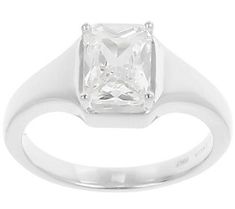 a white gold ring with a princess cut diamond