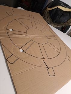 a cardboard box that has been cut out to look like a star trek ship on it