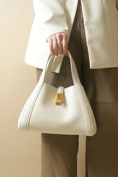 Timeless Handheld Bag For Everyday, Timeless Shoulder Bag For Daily Use, Timeless Handheld Satchel For Everyday Use, Timeless Beige Clutch Shoulder Bag, Versatile Clutch Bag With Smooth Grain, Timeless Everyday Satchel Clutch, Timeless Everyday Satchel In Clutch Shape, Chic White Shoulder Bag For Business, White Soft Leather Shoulder Bag For Business