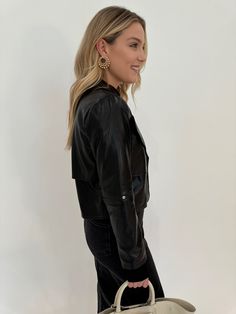 Indulge in luxury while staying true to your values with Adroit Atelier's Ninon Vegan Leather Jacket in Black. Made from super soft vegan leather, this jacket is a timeless and versatile piece that pairs perfectly with any outfit. Its cropped length adds an edgy touch to your look, while the unique elbow detail adds a distinctive flair. Elevate your outerwear collection with this jacket that is both stylish and ethical! Fabrication: 100% PU shell, 100% Poly Spandex lining Details: - Cropped jack Evening Jewelry, Vegan Leather Jacket, Your Values, Leather Jacket Black, Sweater Sale, Jacket Sale, Denim Pant, Skirts For Sale, Denim Dress