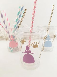 plastic cups with paper straws in the shape of princesses