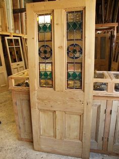 a wooden door with stained glass panels in a shop