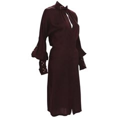 Tom Ford for Gucci Silk Dress 2003 Collection Italian Size 40 - US 4 100% Silk Color - Deep Burgundy Hidden Button Closure at Front Sleeves Finished with Triple Buckle and Grommet Bands Made in Italy. Excellent Condition. Gucci Silk V-neck Dress, Gucci Long Sleeve Evening Dress, Gucci Long Sleeve Silk Dress, Gucci Silk Long Sleeve Dress, Gucci Formal Midi Dress, Elegant Gucci Midi Dress For Work, Chic Gucci Midi Dress For Workwear, Long Sleeve Gucci Dresses For Fall, Gucci Long Sleeve Formal Dress