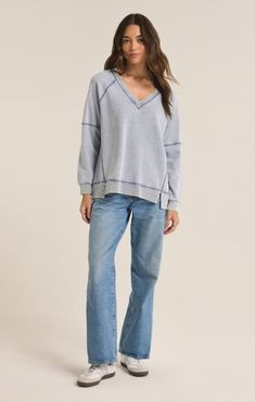 Wrap yourself in the comfort of our knit denim top, made from cozy midweight french terry, given a soft mineral wash. The flattering v-neck design and relaxed fit make this top an easy favorite, season to season. Denim Sweatshirt, Exposed Seams, Knit Denim, Cardigan Sweater Dress, Terry Fabric, Favorite Season, Denim Jumpsuit, One Piece Dress, Fabric Details