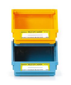 two blue and yellow plastic boxes with labels on the lids, one for pill - up candy